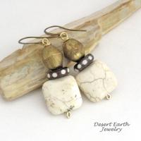 These handcrafted earrings feature natural creamy beige magnesite stones accented with African brass and batik bone beads with a dotted pattern. They have an ethnic tribal, bohemian vibe that makes a unique statement.