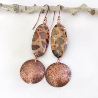 Natural African map jasper stones are accented with hammered copper dangles in these earthy handmade earrings. This type of jasper gets its name because it exhibits the colors and patterns that resemble the markings of the giraffes, cheetahs and other jungle cats that roam Africa. Each stone has its own unique patterns and this pair is no exception with wonderful markings in earthy hues of tan, mossy green, rust, beige and brown.