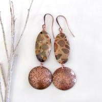 Natural African map jasper stones are accented with hammered copper dangles in these earthy handmade earrings. This type of jasper gets its name because it exhibits the colors and patterns that resemble the markings of the giraffes, cheetahs and other jungle cats that roam Africa. Each stone has its own unique patterns and this pair is no exception with wonderful markings in earthy hues of tan, mossy green, rust, beige and brown.