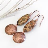 Natural African map jasper stones are accented with hammered copper dangles in these earthy handmade earrings. This type of jasper gets its name because it exhibits the colors and patterns that resemble the markings of the giraffes, cheetahs and other jungle cats that roam Africa. Each stone has its own unique patterns and this pair is no exception with wonderful markings in earthy hues of tan, mossy green, rust, beige and brown.