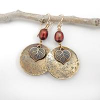 These handcrafted gold brass earrings have a modern, earthy design. They feature tiny brass leaves dangling in front of gold brass dangles accented with shimmery bronze pearls. Makes a great gift for a nature lover or yourself! Perfect for your fall wardrobe - or any time of year. Handmade in the USA by Desert Earth Jewelry.