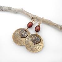 These handcrafted gold brass earrings have a modern, earthy design. They feature tiny brass leaves dangling in front of gold brass dangles accented with shimmery bronze pearls. Makes a great gift for a nature lover or yourself! Perfect for your fall wardrobe - or any time of year. Handmade in the USA by Desert Earth Jewelry.