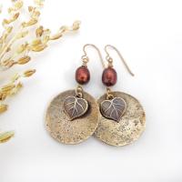 These handcrafted gold brass earrings have a modern, earthy design. They feature tiny brass leaves dangling in front of gold brass dangles accented with shimmery bronze pearls. Makes a great gift for a nature lover or yourself! Perfect for your fall wardrobe - or any time of year. Handmade in the USA by Desert Earth Jewelry.