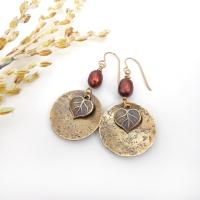 These handcrafted gold brass earrings have a modern, earthy design. They feature tiny brass leaves dangling in front of gold brass dangles accented with shimmery bronze pearls. Makes a great gift for a nature lover or yourself! Perfect for your fall wardrobe - or any time of year. Handmade in the USA by Desert Earth Jewelry.