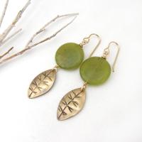Full of earthy natural charm - these handcrafted earrings feature small gold brass leaves with a hand stamped texture accented with round green jade gemstones. Lightweight and comfortable to wear - they'll make a great gift for a nature lover.