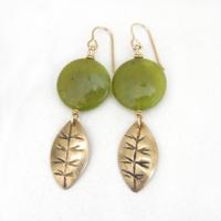 Full of earthy natural charm - these handcrafted earrings feature small gold brass leaves with a hand stamped texture accented with round green jade gemstones. Lightweight and comfortable to wear - they'll make a great gift for a nature lover.