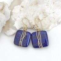 These natural lapis lazuli gemstone earrings have a simple, elegant chic and modern style that coordinates well with all wardrobe types. They are wire wrapped in gold brass wire and dangle from brass ear wires. Lightweight and comfortable to wear. They'll make a great gift for couples celebrating their 9th or 21st wedding anniversary. Brass is the traditional choice for a 21st anniversary and lapis is the gemstone for a 9th anniversary gift.