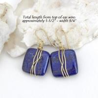 These natural lapis lazuli gemstone earrings have a simple, elegant chic and modern style that coordinates well with all wardrobe types. They are wire wrapped in gold brass wire and dangle from brass ear wires. Lightweight and comfortable to wear. They'll make a great gift for couples celebrating their 9th or 21st wedding anniversary. Brass is the traditional choice for a 21st anniversary and lapis is the gemstone for a 9th anniversary gift.