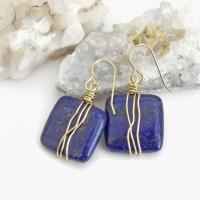 These natural lapis lazuli gemstone earrings have a simple, elegant chic and modern style that coordinates well with all wardrobe types. They are wire wrapped in gold brass wire and dangle from brass ear wires. Lightweight and comfortable to wear. They'll make a great gift for couples celebrating their 9th or 21st wedding anniversary. Brass is the traditional choice for a 21st anniversary and lapis is the gemstone for a 9th anniversary gift.