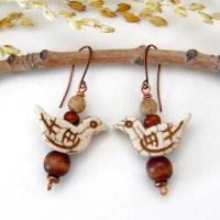 These handmade earrings feature creamy beige magnesite stone birds. They are accented with brown jasper, picture jasper, brown wood and tiny copper beads. Super cute, whimsical and fun to wear -- they'll make a great gift for a nature / bird lover! Your choice of ear wires - copper or hypoallergenic niobium.