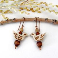 These handmade earrings feature creamy beige magnesite stone birds. They are accented with brown jasper, picture jasper, brown wood and tiny copper beads. Super cute, whimsical and fun to wear -- they'll make a great gift for a nature / bird lover! Your choice of ear wires - copper or hypoallergenic niobium.