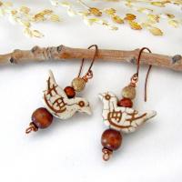 These handmade earrings feature creamy beige magnesite stone birds. They are accented with brown jasper, picture jasper, brown wood and tiny copper beads. Super cute, whimsical and fun to wear -- they'll make a great gift for a nature / bird lover! Your choice of ear wires - copper or hypoallergenic niobium.