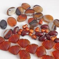 Mixed bead lot for jewelry making / beading / craft supply.  Lot consists of 14 pieces of oval-shaped banded agate beads (black orange white tones with various matrix patterns). Measures approximately 7/8" to 1" in length and 3/4" in width - drilled top to bottom. 12 pieces of burnt orange seashell shaped beads. Measures approximately 1" at widest point and 3/4" in length - drilled top to bottom 9 bright orange organically shaped freshwater pearl beads - drilled 8 dark reddish-brown dried bean beads