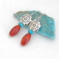 These colorful artisan handmade earrings feature silver-plated native style southwestern cross beads accented with turquoise and fossilized red coral. Lightweight and fun to wear, they'll add a touch of southwestern charm to your wardrobe. Makes a great gift for women that love the Santa Fe southwest style. 