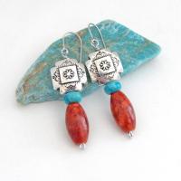 These colorful artisan handmade earrings feature silver-plated native style southwestern cross beads accented with turquoise and fossilized red coral. Lightweight and fun to wear, they'll add a touch of southwestern charm to your wardrobe. Makes a great gift for women that love the Santa Fe southwest style. 