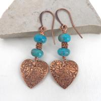 Small and petite, yet full of romantic charm - these handmade earrings feature small copper hearts with a hand stamped texture accented with blue turquoise stones and tiny copper beads. They'll make the perfect gift for someone special - a wonderful way to say "I love you" on Valentine's Day or any day! Makes a great gift for couples celebrating their 7th wedding anniversary - copper is the traditional choice for this occasion. Handmade in the USA by Desert Earth Jewelry.