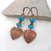 Small and petite, yet full of romantic charm - these handmade earrings feature small copper hearts with a hand stamped texture accented with blue turquoise stones and tiny copper beads. They'll make the perfect gift for someone special - a wonderful way to say "I love you" on Valentine's Day or any day! Makes a great gift for couples celebrating their 7th wedding anniversary - copper is the traditional choice for this occasion. Handmade in the USA by Desert Earth Jewelry.