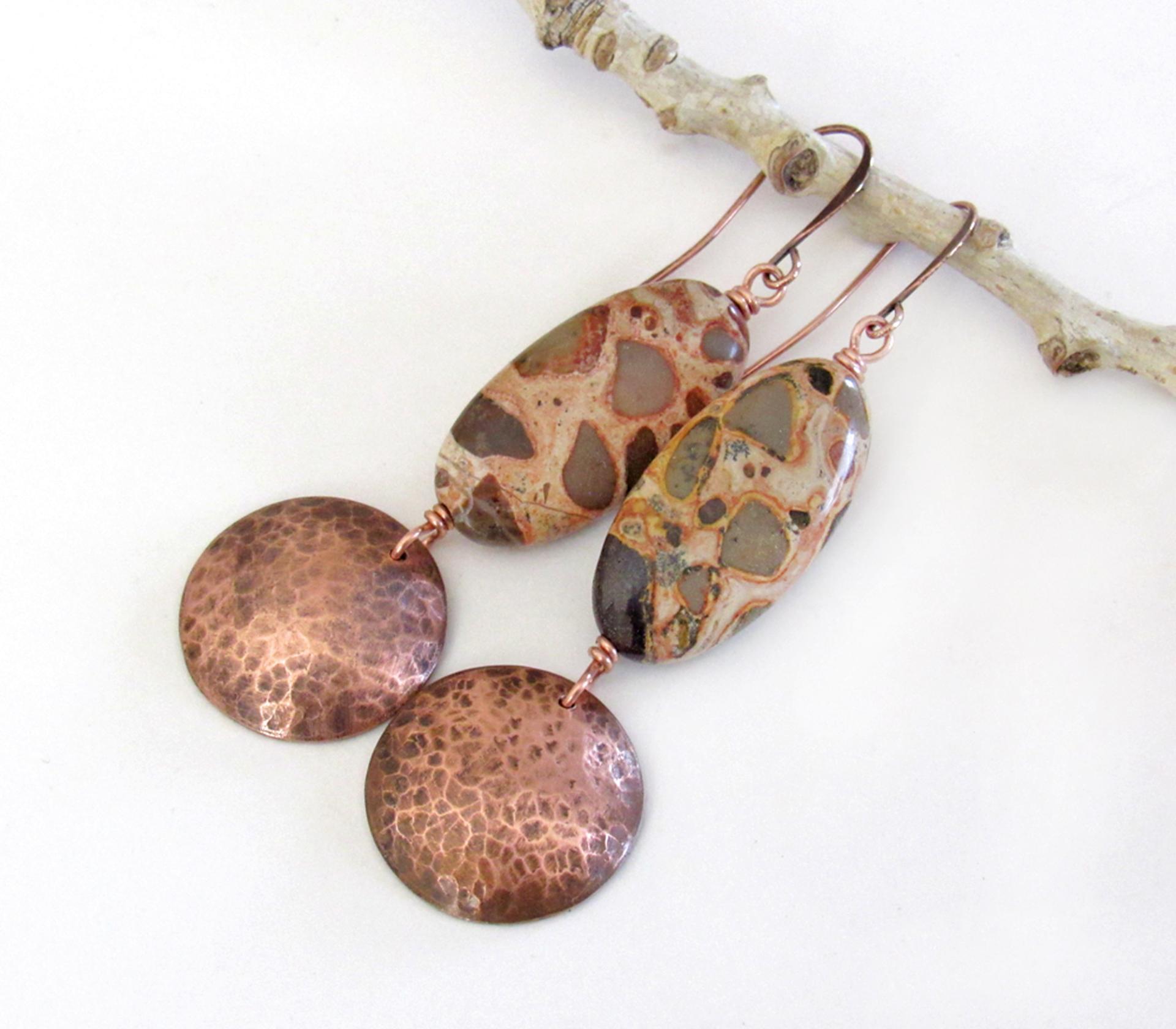 Natural African map jasper stones are accented with hammered copper dangles in these earthy handmade earrings. This type of jasper gets its name because it exhibits the colors and patterns that resemble the markings of the giraffes, cheetahs and other jungle cats that roam Africa. Each stone has its own unique patterns and this pair is no exception with wonderful markings in earthy hues of tan, mossy green, rust, beige and brown.