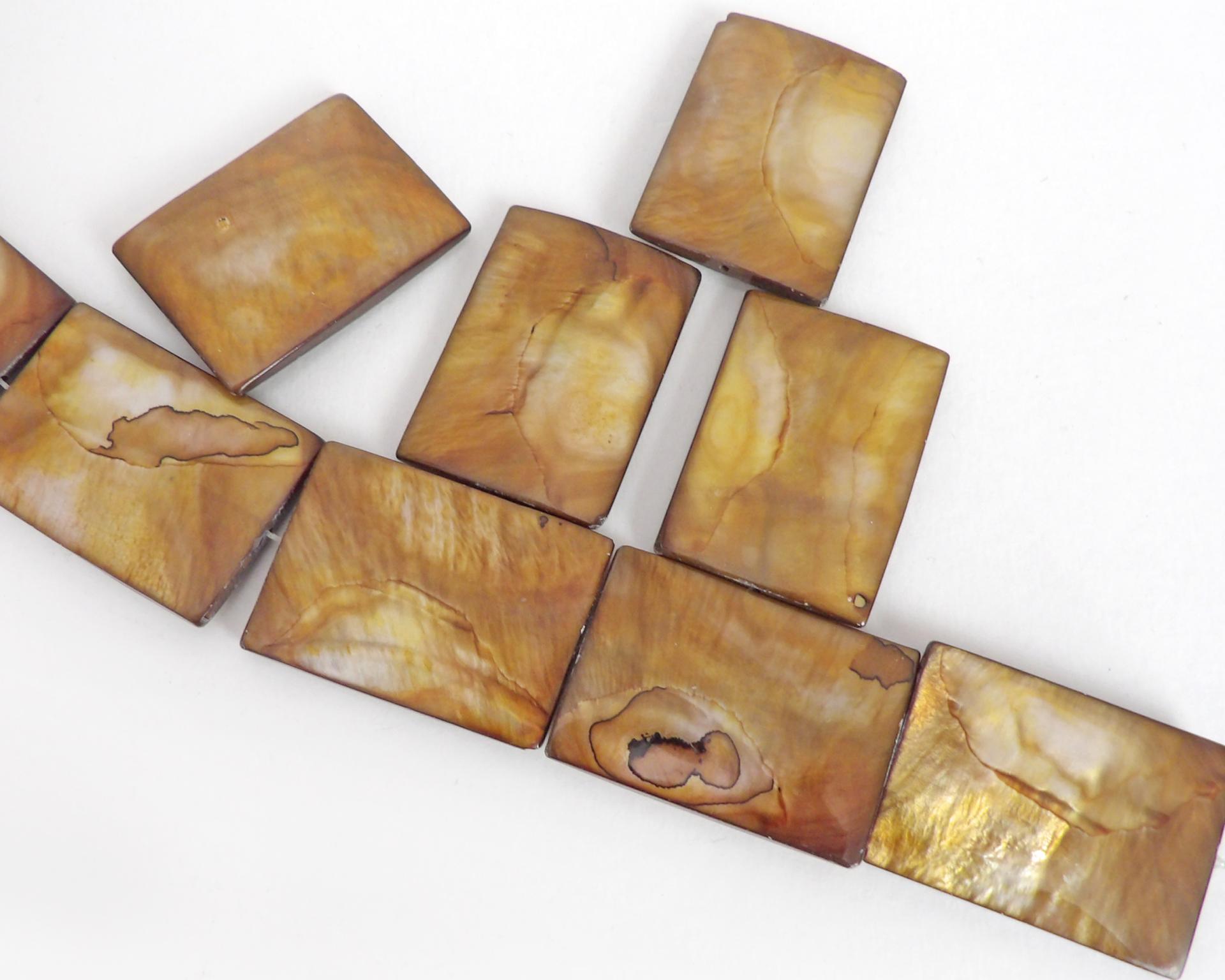 Beautiful Golden Mother of Pearl beads for jewelry making. Nice large rectangular size for pendants measuring approx. 1-3/8" in length and 1" width. Drilled top to bottom. Total of 10 pieces. 