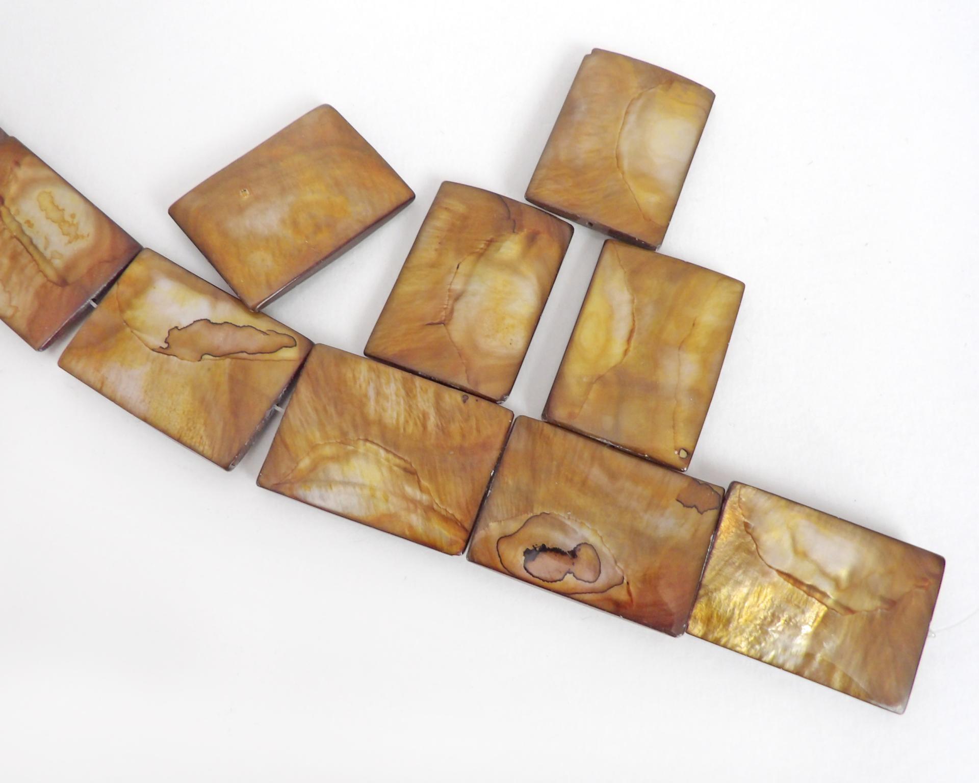 Beautiful Golden Mother of Pearl beads for jewelry making. Nice large rectangular size for pendants measuring approx. 1-3/8" in length and 1" width. Drilled top to bottom. Total of 10 pieces. 
