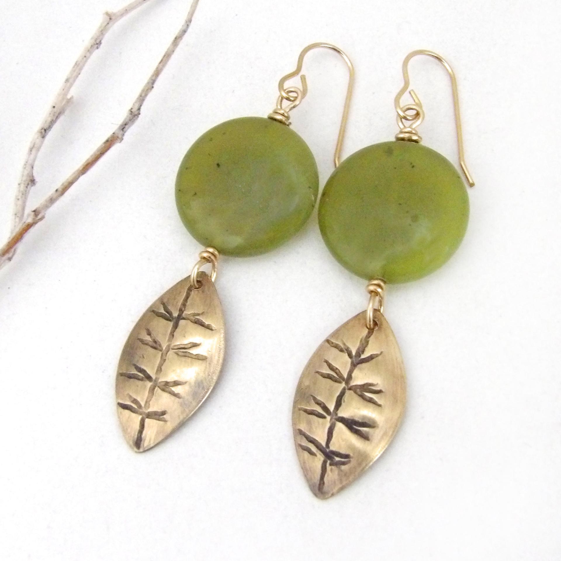 Full of earthy natural charm - these handcrafted earrings feature small gold brass leaves with a hand stamped texture accented with round green jade gemstones. Lightweight and comfortable to wear - they'll make a great gift for a nature lover.