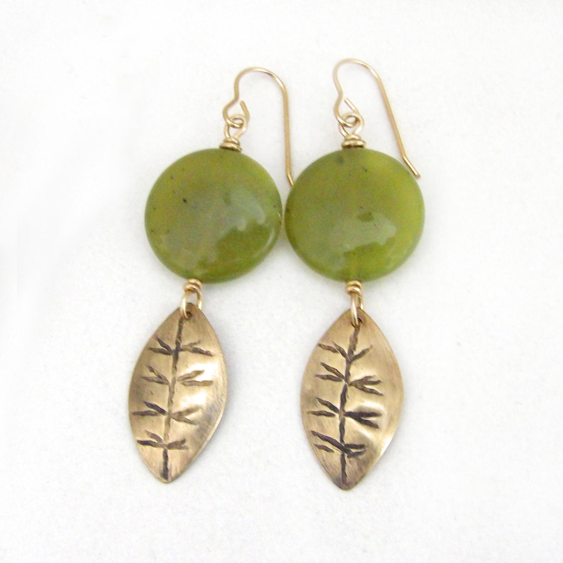 Full of earthy natural charm - these handcrafted earrings feature small gold brass leaves with a hand stamped texture accented with round green jade gemstones. Lightweight and comfortable to wear - they'll make a great gift for a nature lover.