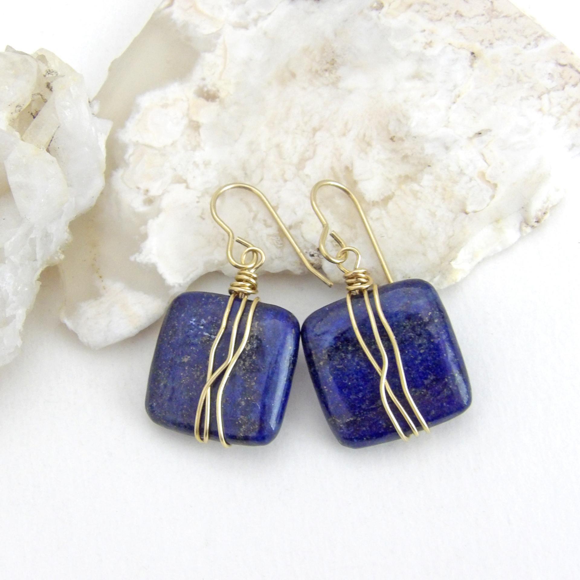 These natural lapis lazuli gemstone earrings have a simple, elegant chic and modern style that coordinates well with all wardrobe types. They are wire wrapped in gold brass wire and dangle from brass ear wires. Lightweight and comfortable to wear. They'll make a great gift for couples celebrating their 9th or 21st wedding anniversary. Brass is the traditional choice for a 21st anniversary and lapis is the gemstone for a 9th anniversary gift.
