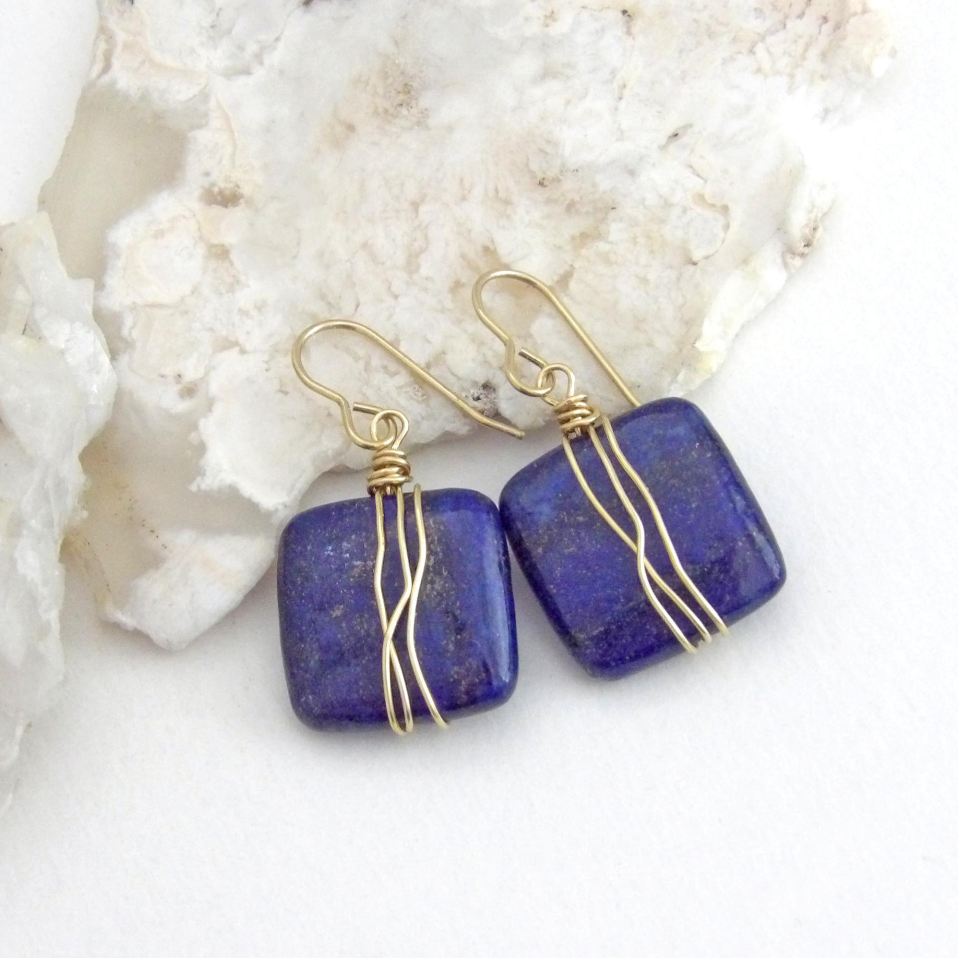 These natural lapis lazuli gemstone earrings have a simple, elegant chic and modern style that coordinates well with all wardrobe types. They are wire wrapped in gold brass wire and dangle from brass ear wires. Lightweight and comfortable to wear. They'll make a great gift for couples celebrating their 9th or 21st wedding anniversary. Brass is the traditional choice for a 21st anniversary and lapis is the gemstone for a 9th anniversary gift.