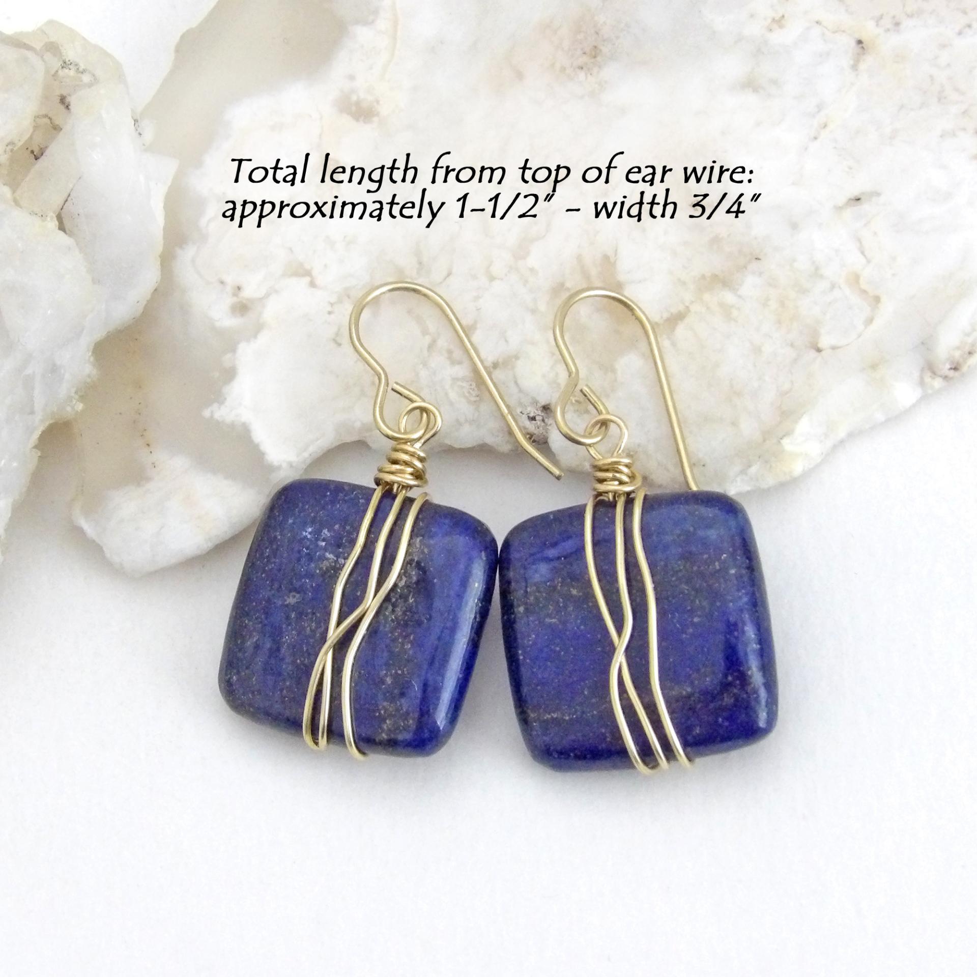 These natural lapis lazuli gemstone earrings have a simple, elegant chic and modern style that coordinates well with all wardrobe types. They are wire wrapped in gold brass wire and dangle from brass ear wires. Lightweight and comfortable to wear. They'll make a great gift for couples celebrating their 9th or 21st wedding anniversary. Brass is the traditional choice for a 21st anniversary and lapis is the gemstone for a 9th anniversary gift.
