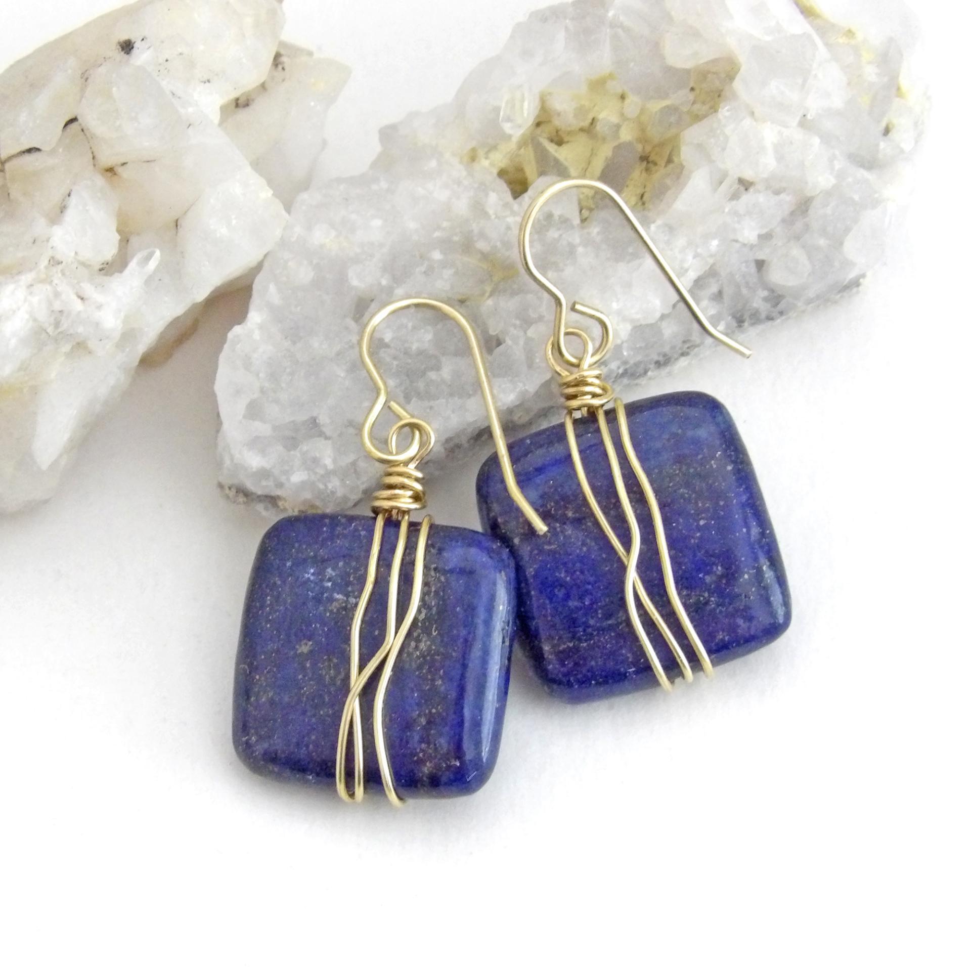 These natural lapis lazuli gemstone earrings have a simple, elegant chic and modern style that coordinates well with all wardrobe types. They are wire wrapped in gold brass wire and dangle from brass ear wires. Lightweight and comfortable to wear. They'll make a great gift for couples celebrating their 9th or 21st wedding anniversary. Brass is the traditional choice for a 21st anniversary and lapis is the gemstone for a 9th anniversary gift.