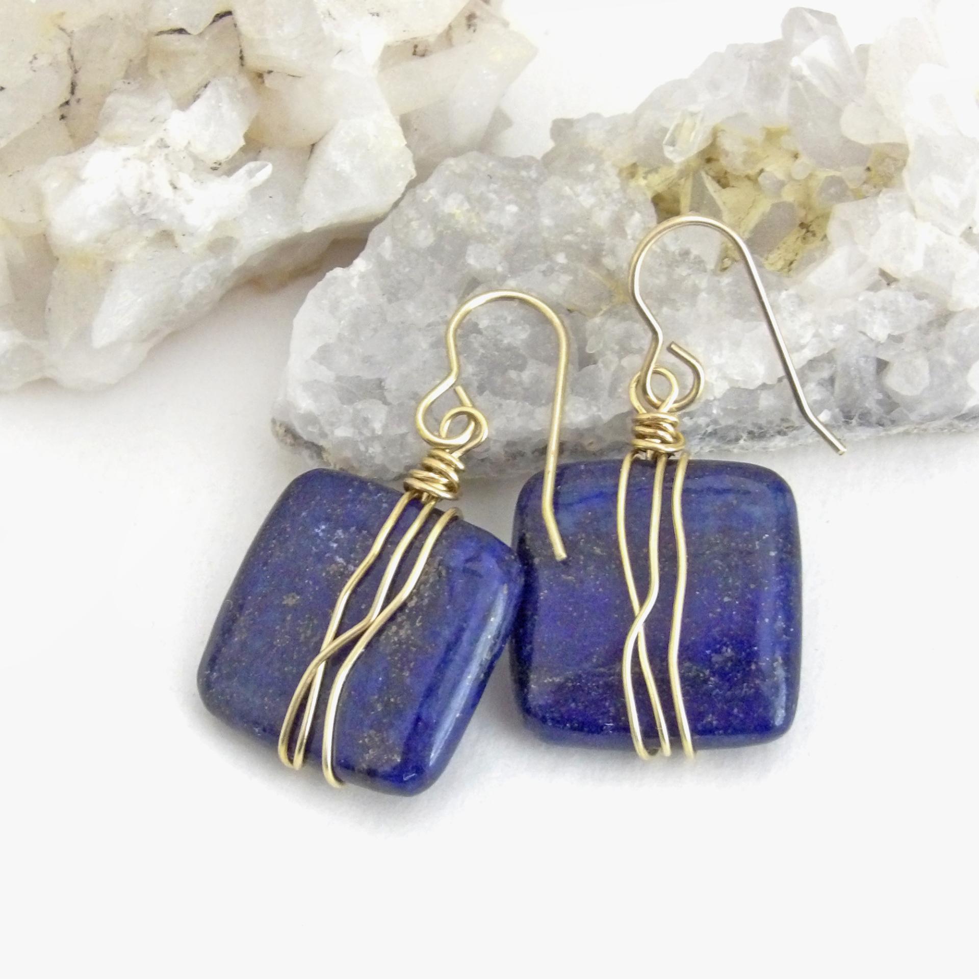 These natural lapis lazuli gemstone earrings have a simple, elegant chic and modern style that coordinates well with all wardrobe types. They are wire wrapped in gold brass wire and dangle from brass ear wires. Lightweight and comfortable to wear. They'll make a great gift for couples celebrating their 9th or 21st wedding anniversary. Brass is the traditional choice for a 21st anniversary and lapis is the gemstone for a 9th anniversary gift.