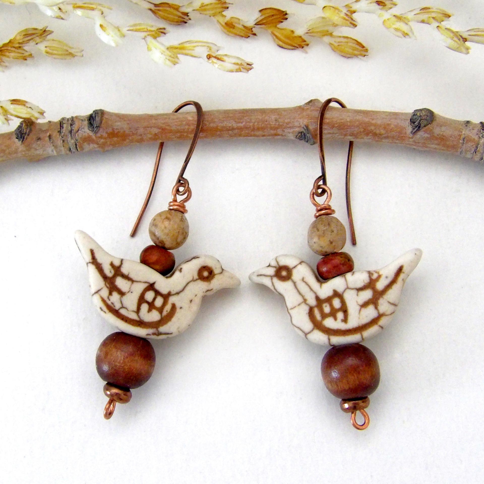 These handmade earrings feature creamy beige magnesite stone birds. They are accented with brown jasper, picture jasper, brown wood and tiny copper beads. Super cute, whimsical and fun to wear -- they'll make a great gift for a nature / bird lover! Your choice of ear wires - copper or hypoallergenic niobium.
