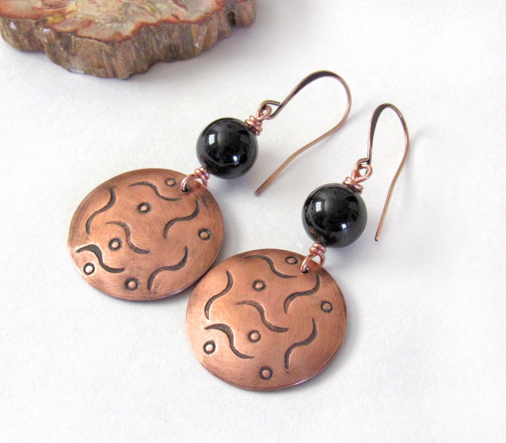 These handcrafted copper dangle earrings have a hand stamped texture and are accented with natural black onyx gemstones. They have a classic modern style that coordinates with all wardrobe types. They'll make a great gift for couples celebrating their 7th wedding anniversary - copper is the traditional metal and onyx is the traditional gemstone for this occasion.