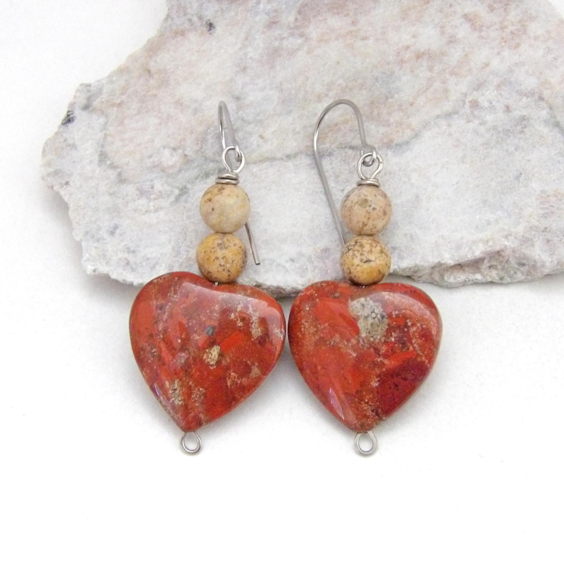 These handmade earrings feature heart shaped brecciated red jasper gemstones accented with beige picture jasper stones on surgical steel ear wires. This type of jasper has a brick red hue with natural inclusions. Full of romantic charm - they'll make a great gift for Valentine's Day, Mother's Day, a wedding anniversary, or simply to say "I love you".
