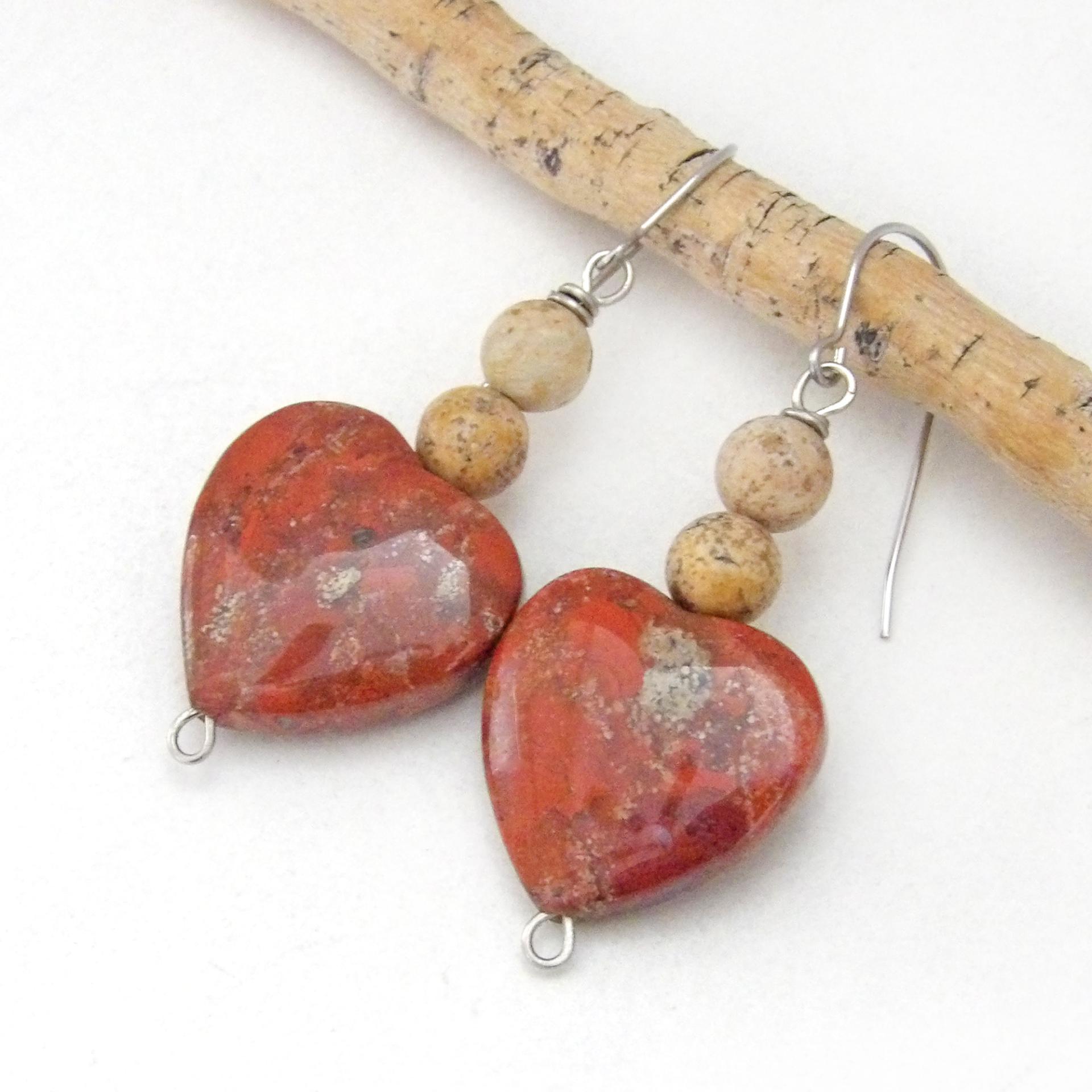 These handmade earrings feature heart shaped brecciated red jasper gemstones accented with beige picture jasper stones on surgical steel ear wires. This type of jasper has a brick red hue with natural inclusions. Full of romantic charm - they'll make a great gift for Valentine's Day, Mother's Day, a wedding anniversary, or simply to say "I love you".