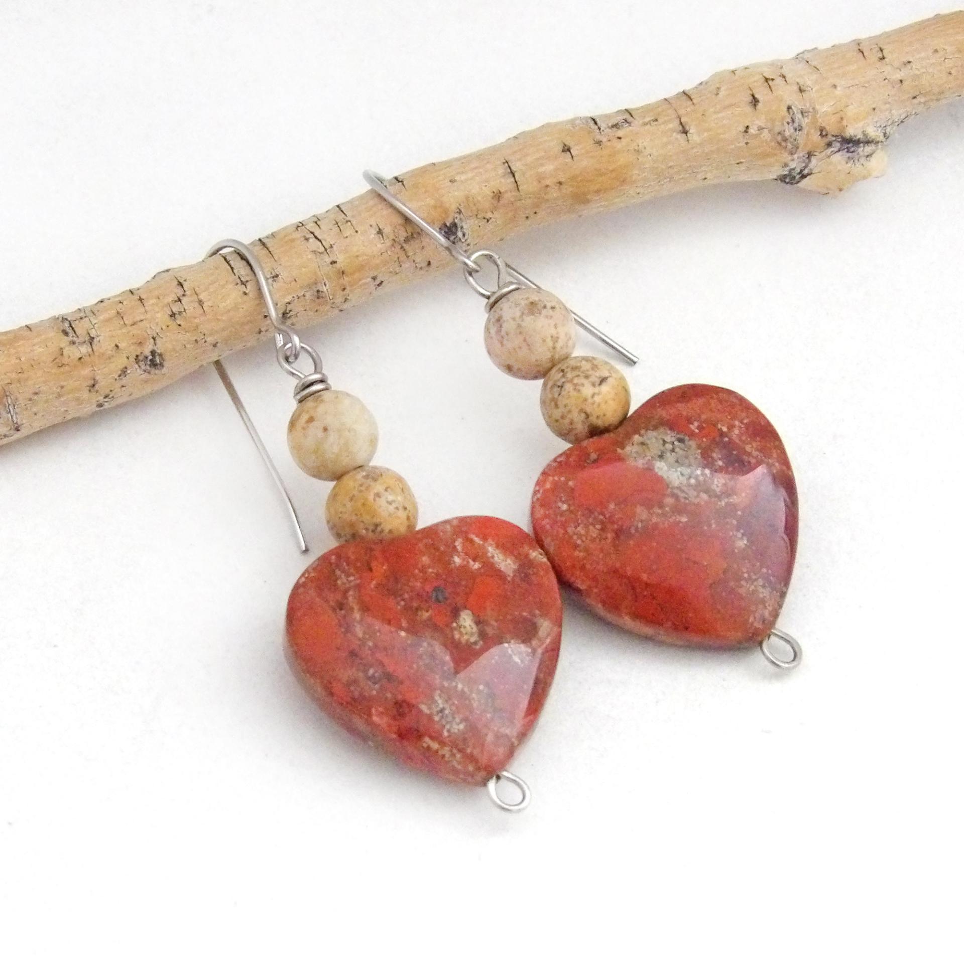 These handmade earrings feature heart shaped brecciated red jasper gemstones accented with beige picture jasper stones on surgical steel ear wires. This type of jasper has a brick red hue with natural inclusions. Full of romantic charm - they'll make a great gift for Valentine's Day, Mother's Day, a wedding anniversary, or simply to say "I love you".