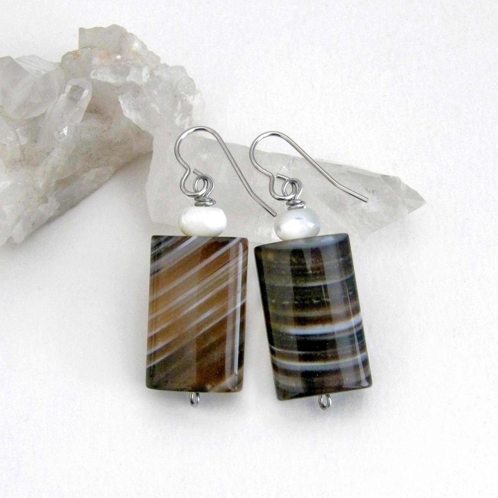 Simple, yet elegant - these earrings feature natural sardonyx gemstones with a striking natural black and white striped pattern accented with white moonstones. Sardonyx is a type of agate formed when minerals form in between strips of black onyx which gives the stone a banded, "striped" appearance. The modern, elegant style will look great dressed up or down. They'll make a great gift for someone with an August birthday - sardonyx is the original and oldest recorded birthstone for August.