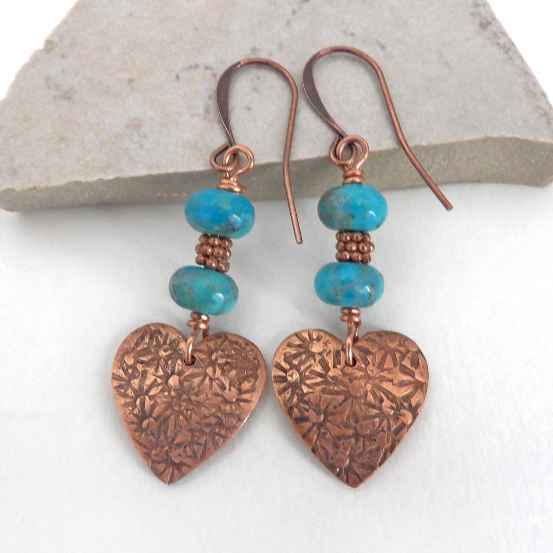 Small and petite, yet full of romantic charm - these handmade earrings feature small copper hearts with a hand stamped texture accented with blue turquoise stones and tiny copper beads. They'll make the perfect gift for someone special - a wonderful way to say "I love you" on Valentine's Day or any day! Makes a great gift for couples celebrating their 7th wedding anniversary - copper is the traditional choice for this occasion. Handmade in the USA by Desert Earth Jewelry.