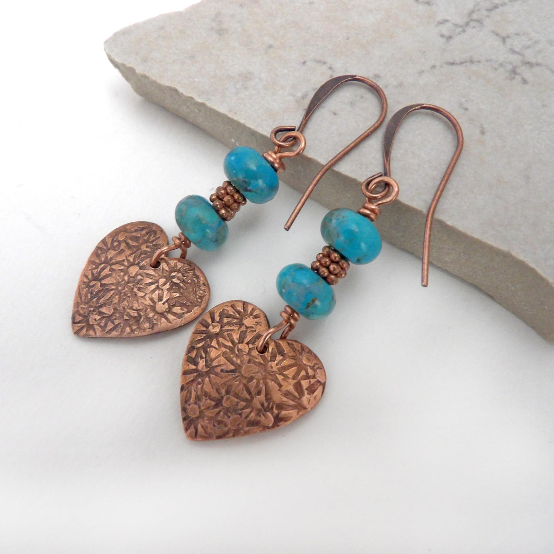 Small and petite, yet full of romantic charm - these handmade earrings feature small copper hearts with a hand stamped texture accented with blue turquoise stones and tiny copper beads. They'll make the perfect gift for someone special - a wonderful way to say "I love you" on Valentine's Day or any day! Makes a great gift for couples celebrating their 7th wedding anniversary - copper is the traditional choice for this occasion. Handmade in the USA by Desert Earth Jewelry.