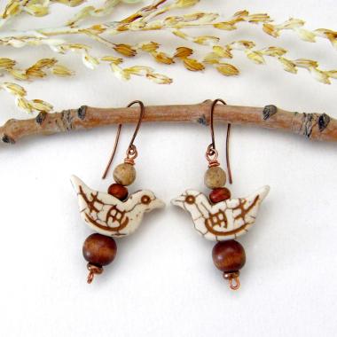 These handmade earrings feature creamy beige magnesite stone birds. They are accented with brown jasper, picture jasper, brown wood and tiny copper beads. Super cute, whimsical and fun to wear -- they'll make a great gift for a nature / bird lover! Your choice of ear wires - copper or hypoallergenic niobium.
